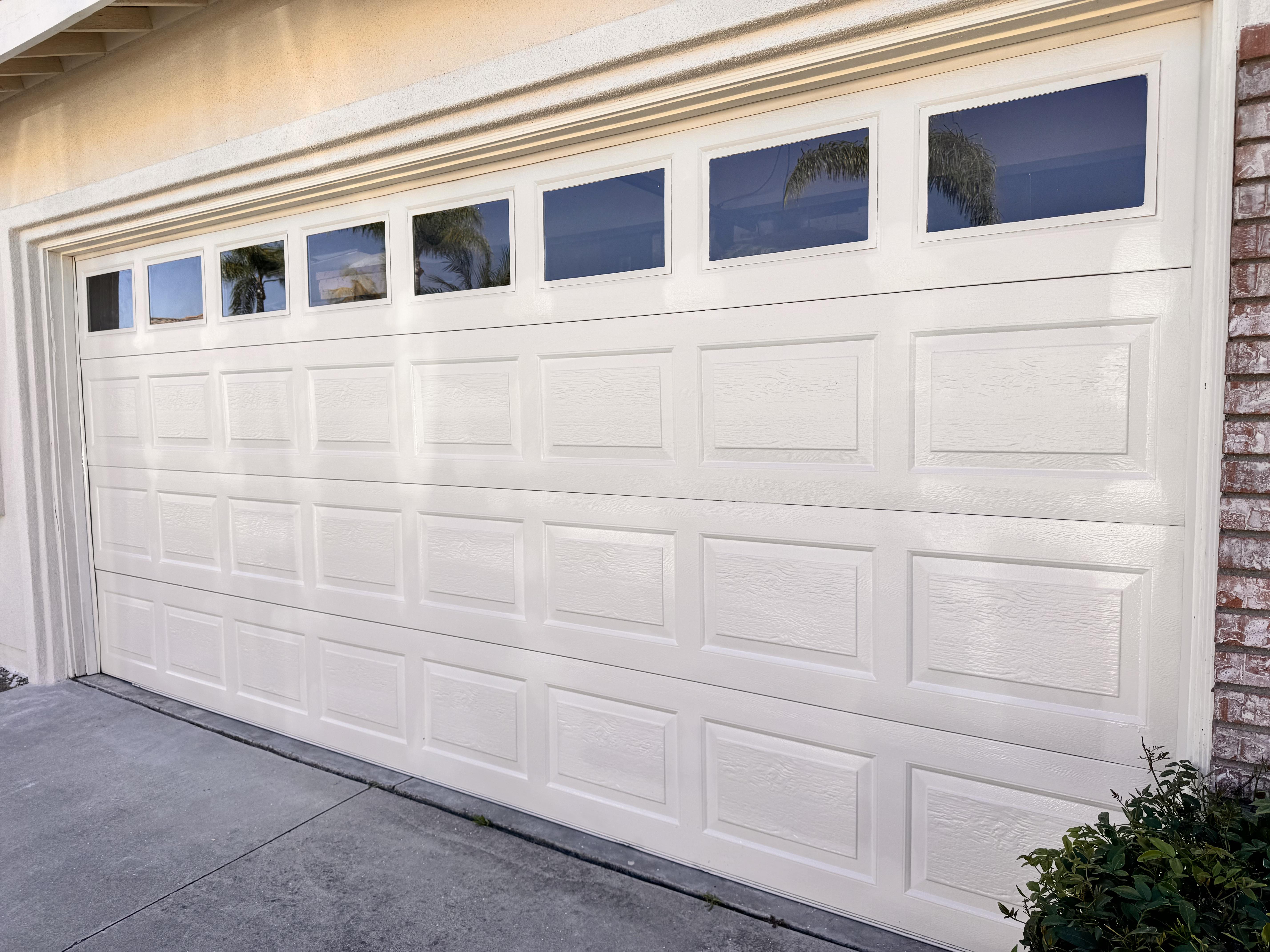 After photo of restored garage door with clean updated finish